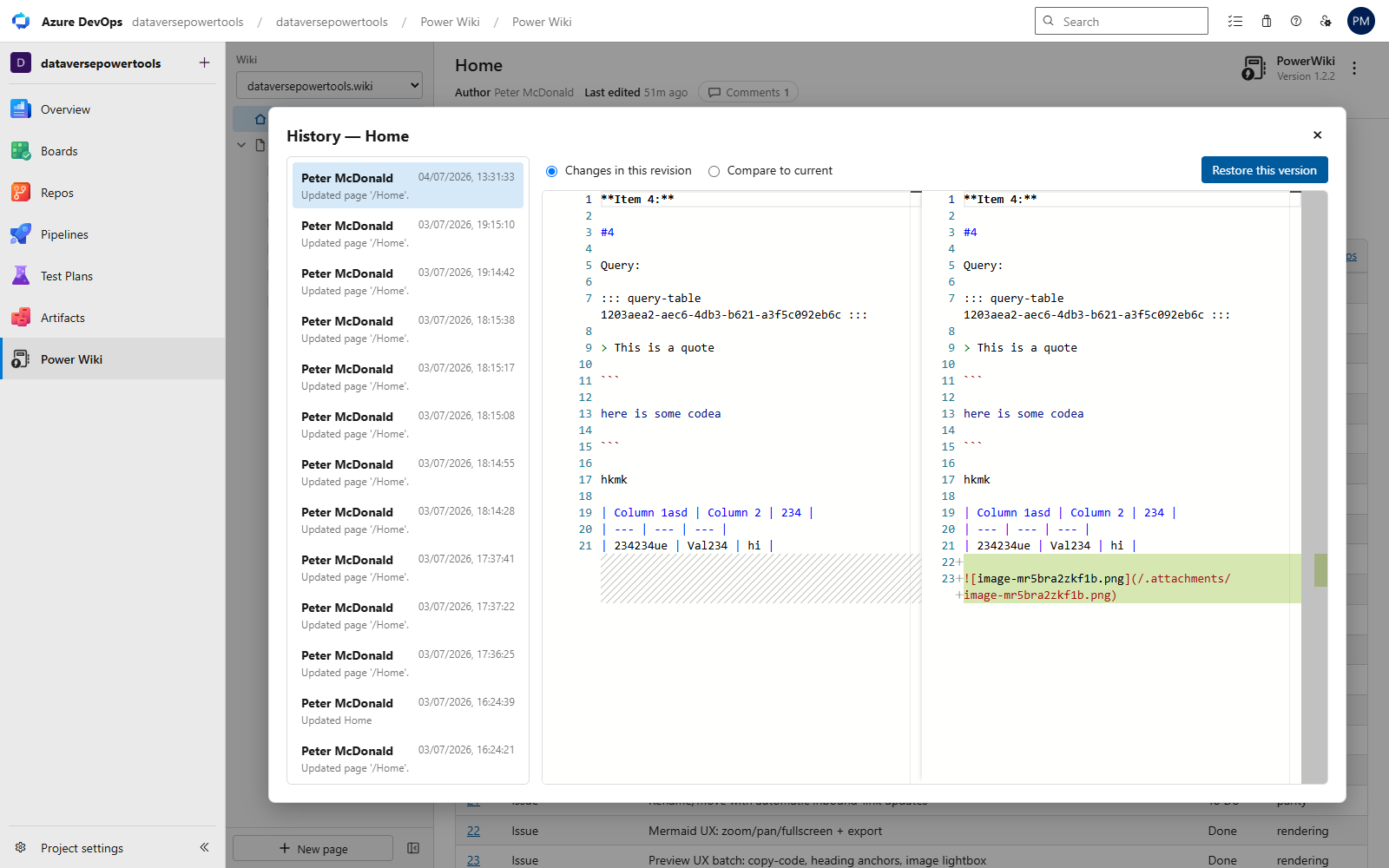 Page history with a side-by-side Monaco diff and restore